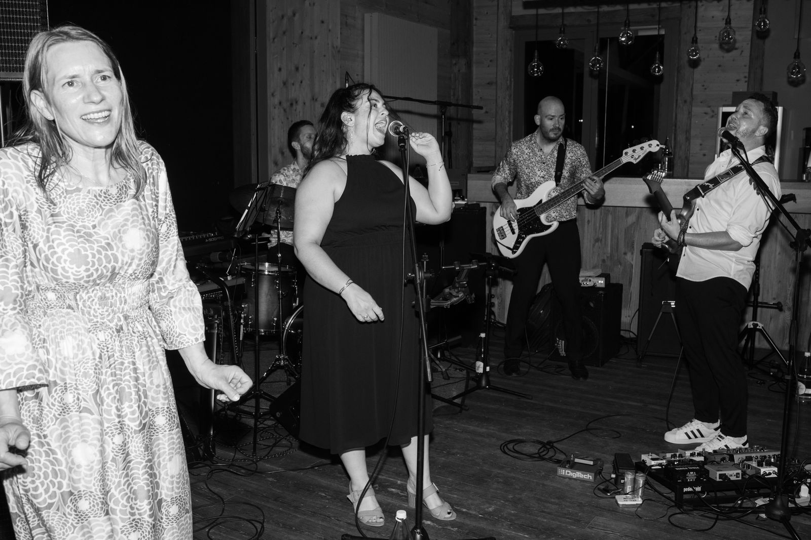 The live band and a dancing guest in full celebration